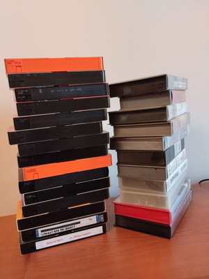 Video cassettes used, pack of 26 with various movies and shows