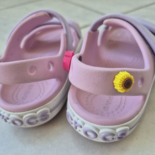 Crocs pink sandals with 3 charms, size C9