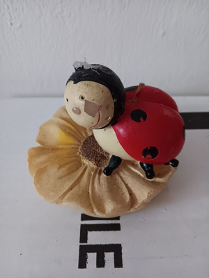 Candle used children's ladybug shape with flower
