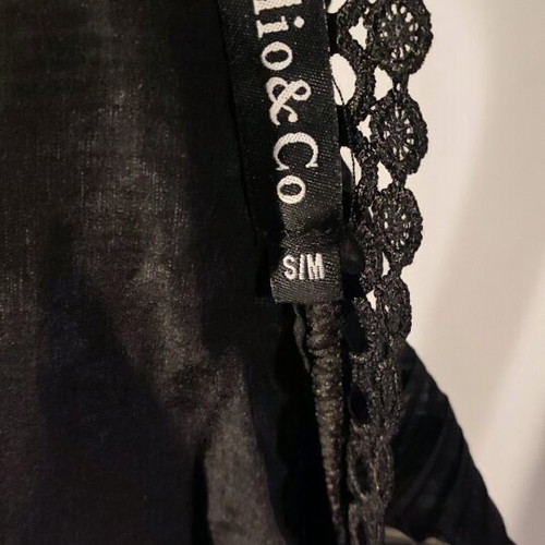 Black Jolio & Co top like new with ruffles and lace details, size S/M