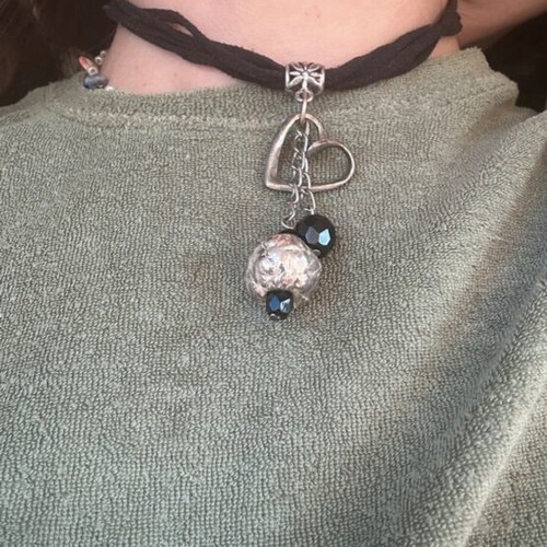 Choker necklace like new with black cord and silver decorative elements