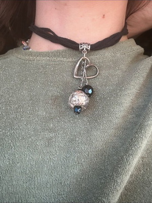 Choker necklace like new with black cord and silver decorative elements