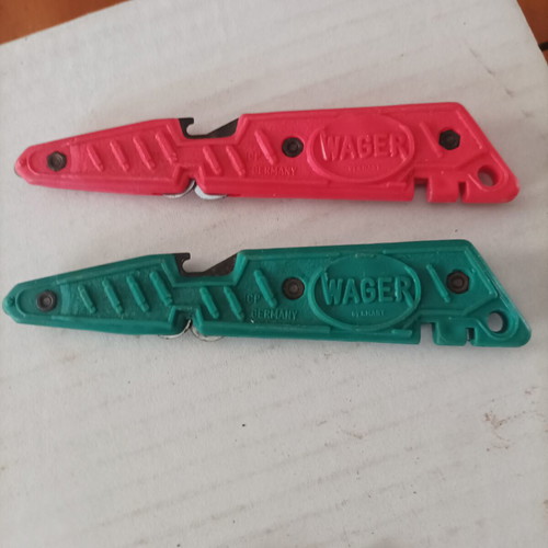 Various tools used including cable strippers, vintage bicycle wrench, glass cutter