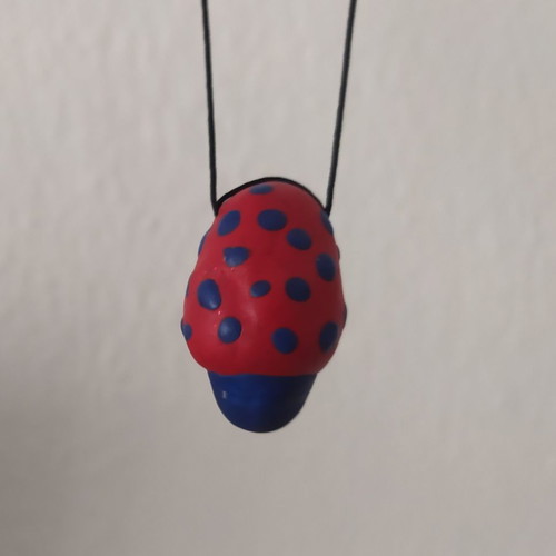 FIMO necklace used with red and blue mushroom design
