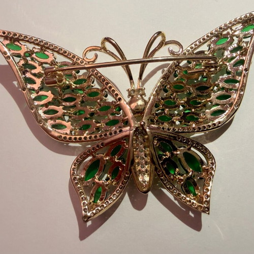 Vintage butterfly brooch with green cabochon stones and white zircon, like new