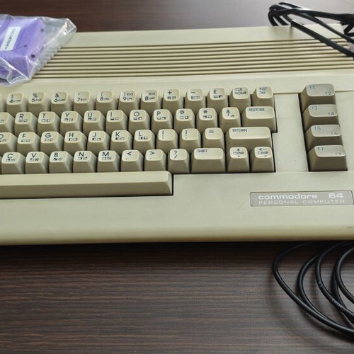 Commodore C64c personal computer with joystick and accessories