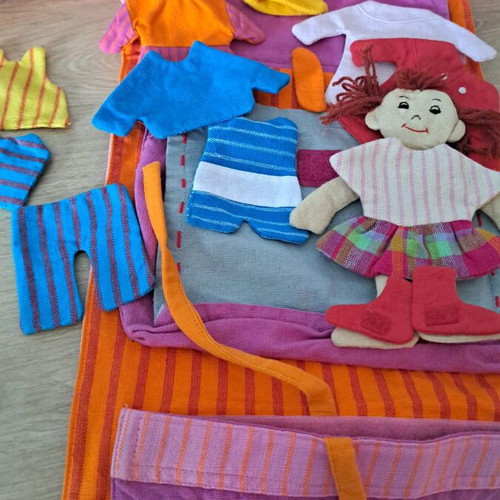 Cloth bag with doll and clothes used