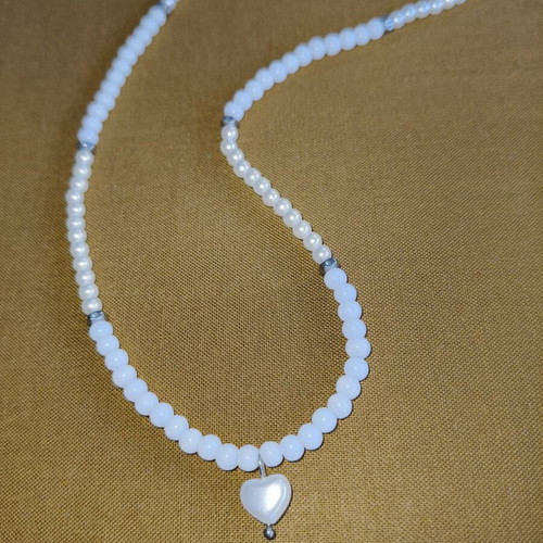 Handmade long pearl necklace with silver details and heart pendant