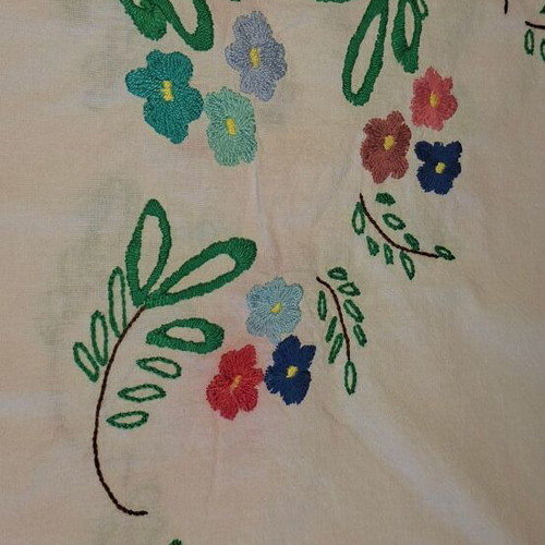 Vintage handmade embroidered tablecloth with flowers and needlework