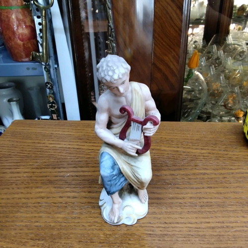 Ceramic figurine new with young male figure holding a lyre
