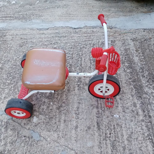 Red children's tricycle with extra foam seat