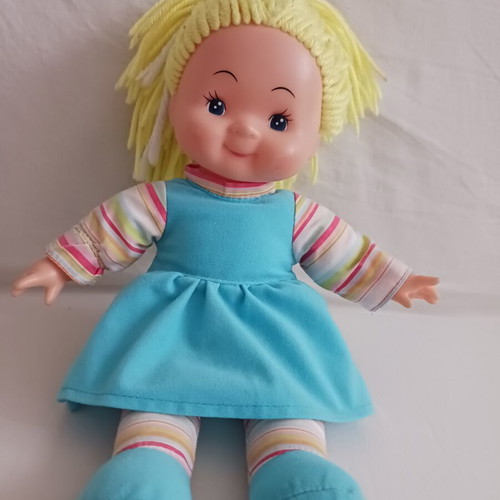 Doll with blonde yarn hair like new, soft body