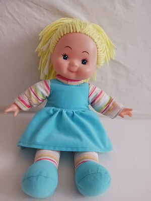 Doll with blonde yarn hair like new, soft body