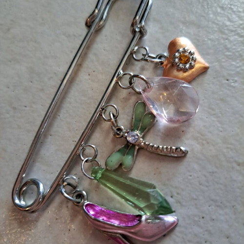 Pin with dangling charms like new