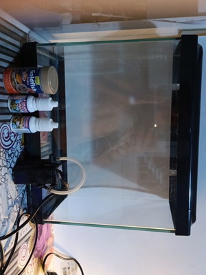 Aquarium 15 liters used with filter, food, and health bottles