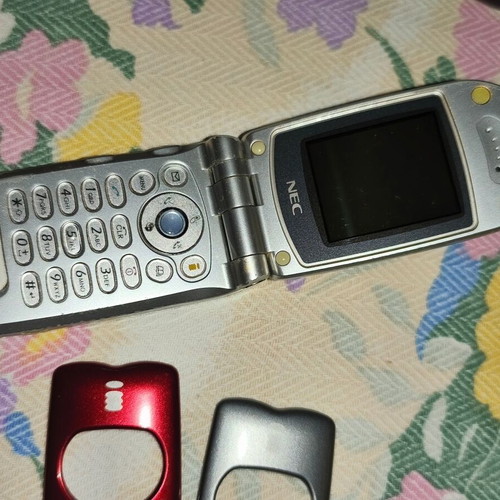 Nec mobile phone used with extra covers, collectible