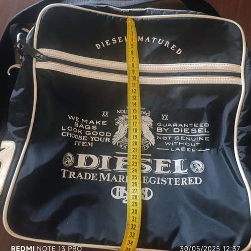 Diesel shoulder bag used, black with adjustable strap and compartments