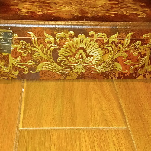 Wooden antique box used with embossed bronze decorations