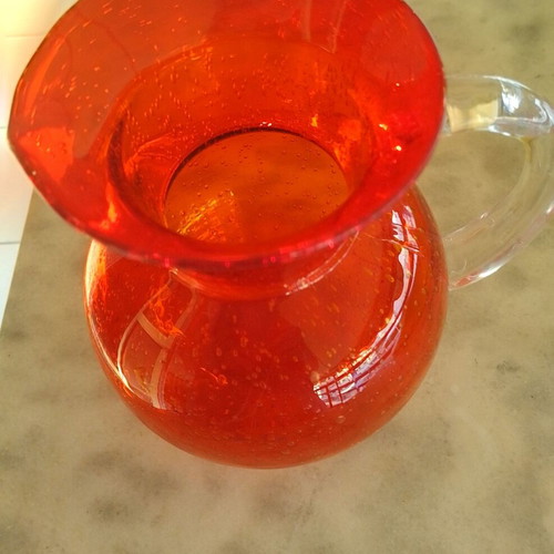 Vintage glass pitcher with handle, orange color, new