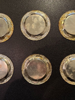 Silver-plated carved coasters like new