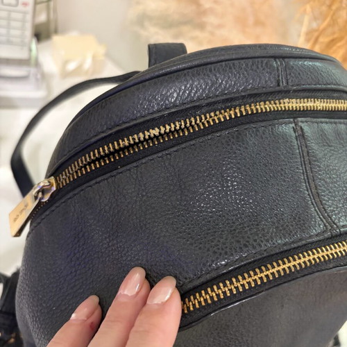Michael Kors leather backpack used with broken zipper black