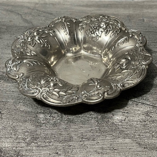 Decorative metal bowl used with embossed design