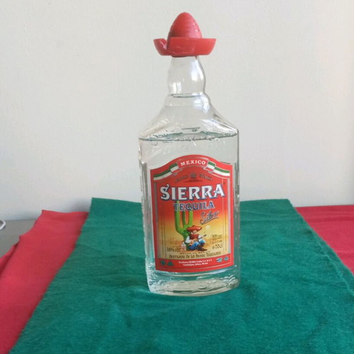 Sierra vintage tequila used, opened bottle with cap damage