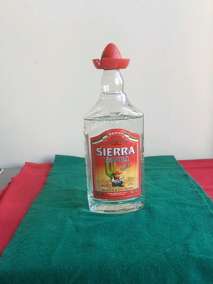 Sierra vintage tequila used, opened bottle with cap damage