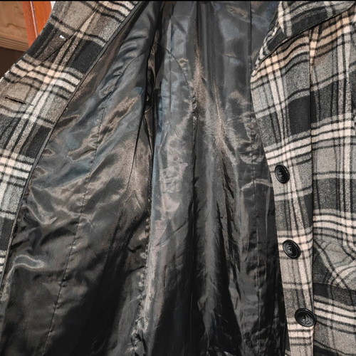 Checked coat with high collar, pockets and buttons