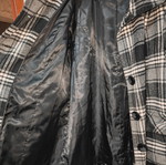 Checked coat with high collar, pockets and buttons