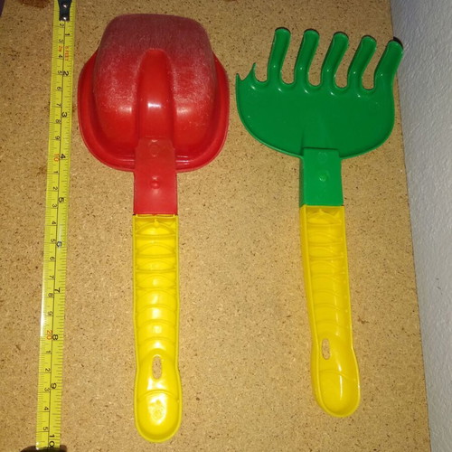 Sand bucket used with shovel, rake and 4 toy cars