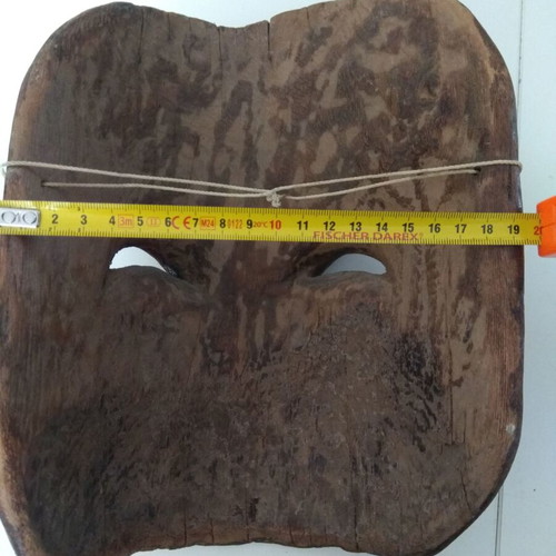Handmade wooden mask used with aged patina