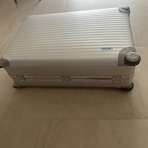 Rimowa travel bag used, silver color, slight defect