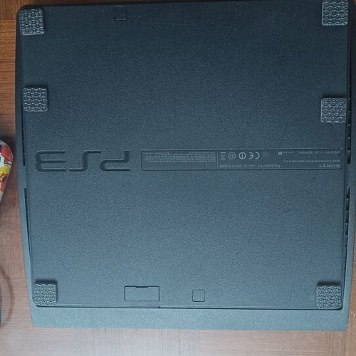 PS3 Slim CECH-2004B console like new with DualShock 3 and 14 games
