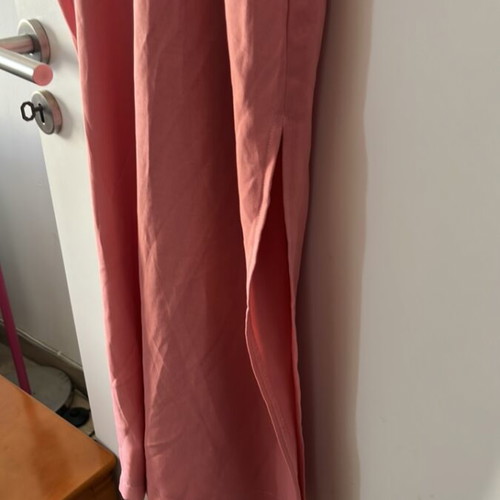 One-piece jumpsuit size S, like new, with ruffles and side openings