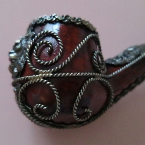 Wooden pipe with intricate silver decoration used