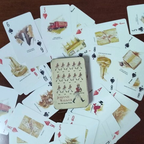Johnnie Walker collectible playing cards laminated in metal box like new