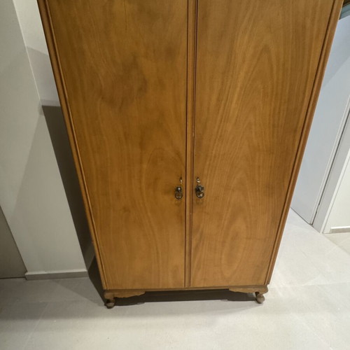 Wooden double-door wardrobe with internal drawers