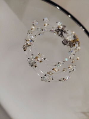 Handmade bracelet with crystals, pearls, and steel elements