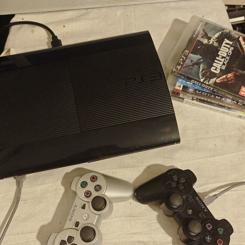 PlayStation 3 Super Slim console 1TB with controllers and games