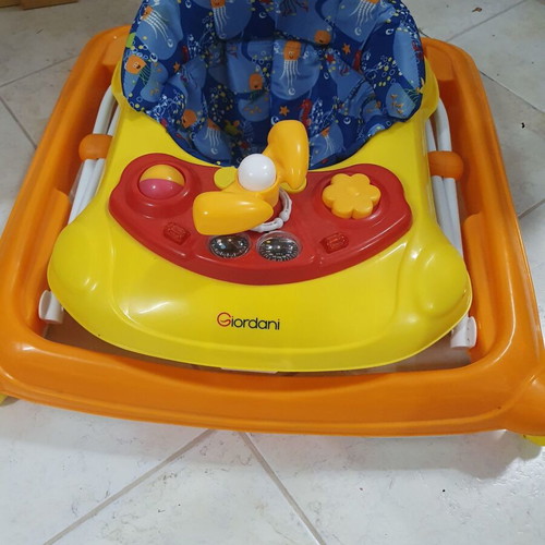 Baby walker like new with toys and comfortable seat