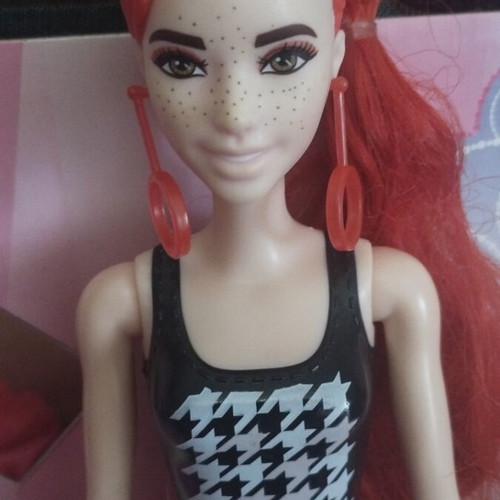 Barbie Colour Reveal doll with red dress
