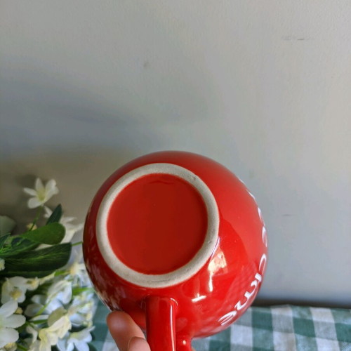 Large mug used for coffee or cereals, red