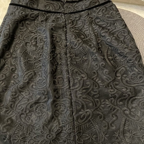 Zinas black mini pencil skirt made of embossed brocade fabric