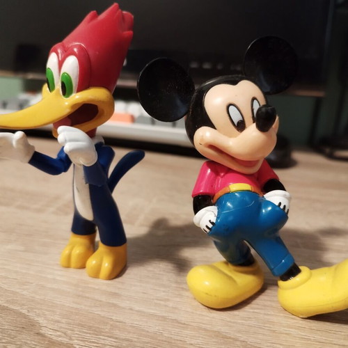 Mickey Mouse and Woody figures like new