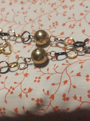 Necklace used, plastic silver with black and gold