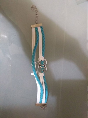 Handmade bracelet with white and blue straps, like new