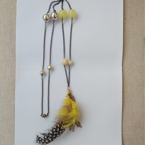 Long necklace new with feathers and yellow beads