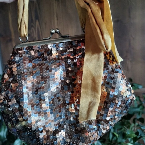 Pouch like new, gold copper with ribbon and sequins