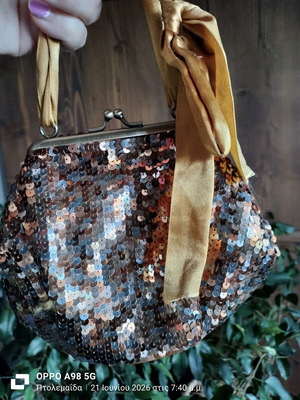 Pouch like new, gold copper with ribbon and sequins